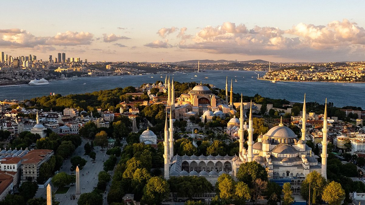 The Blue Mosque and Hagia Sophia with the Bosphorus and modern Istanbul skyline behind