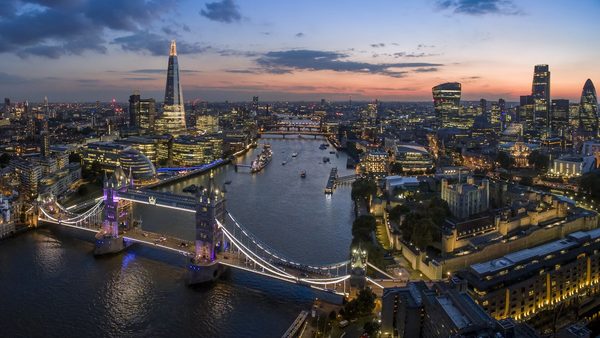 Tower Bridge, the Thames and the Shard lit up at dusk in London