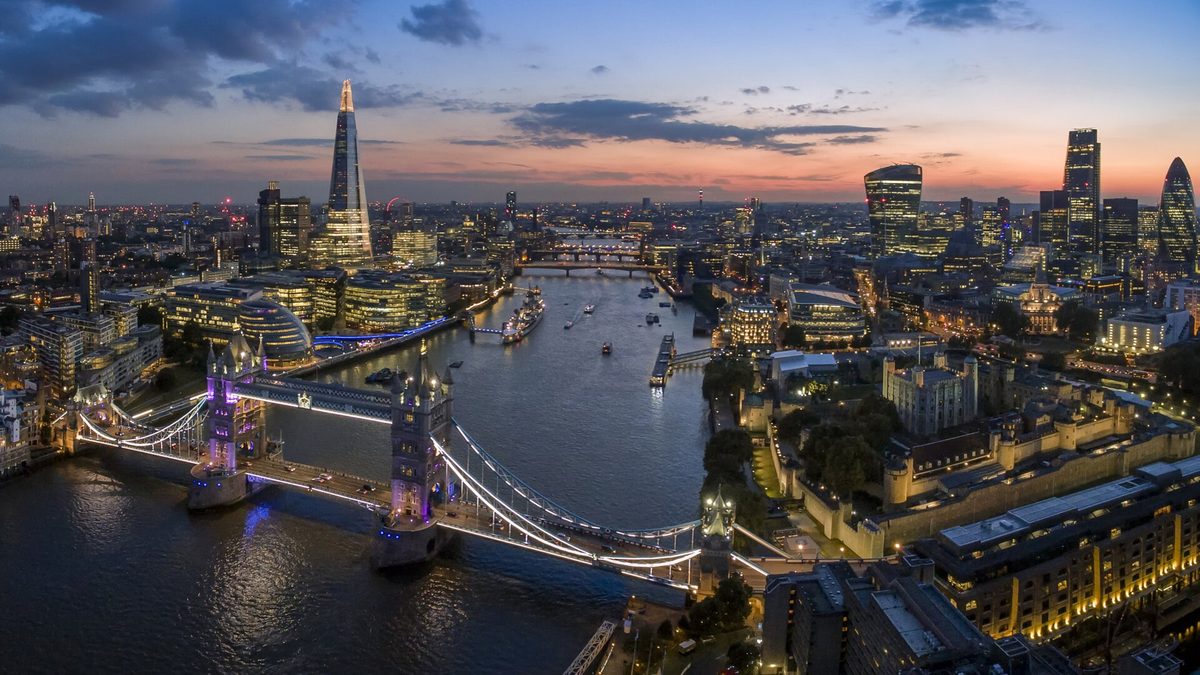 Tower Bridge, the Thames and the Shard lit up at dusk in London