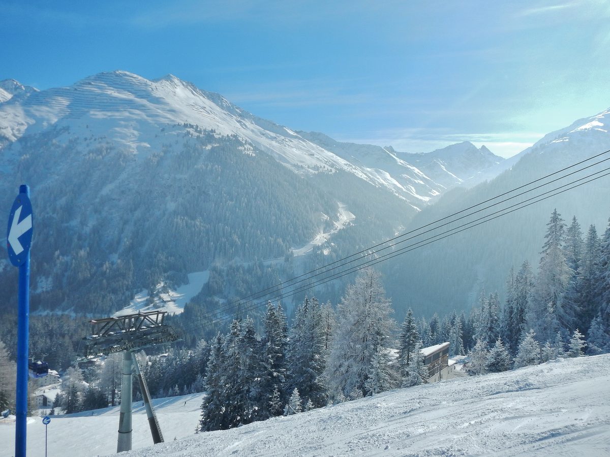Snowy Arlberg peaks seen past the Galzig lift in the St. Anton ski area